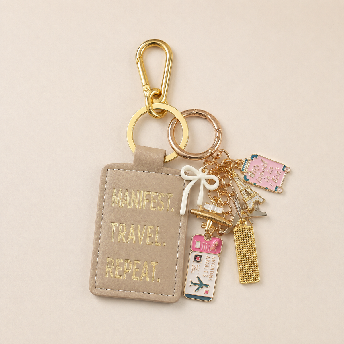 SOLD OUT: Manifest. Travel. Repeat. Signature Bag Charm & Keychain